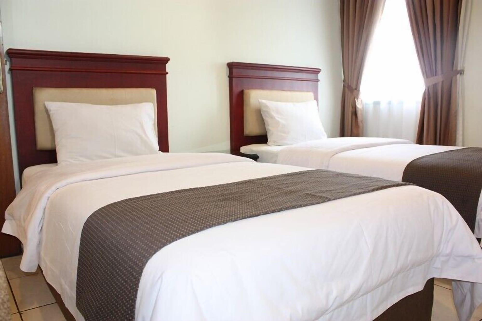 Travellers Suites Serviced Apartments Медан Екстериор снимка